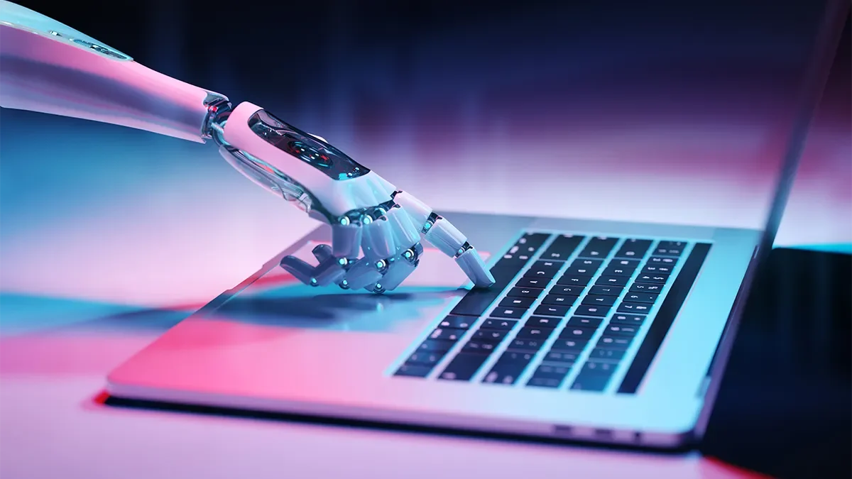 A robot hand types on a keyboard to illustrate AI overviews and other changes on Google. Expert digital marketing services from Webmart.