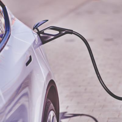 Electric vehicle charging station charging a car.