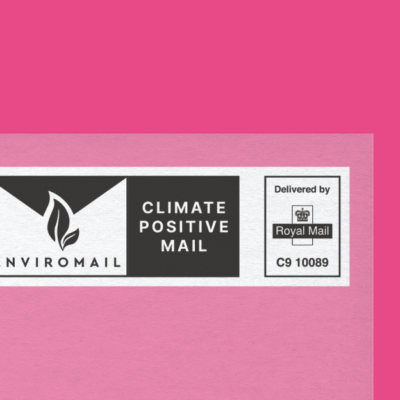 Climate positive mail enviromail logo on a pink background.
