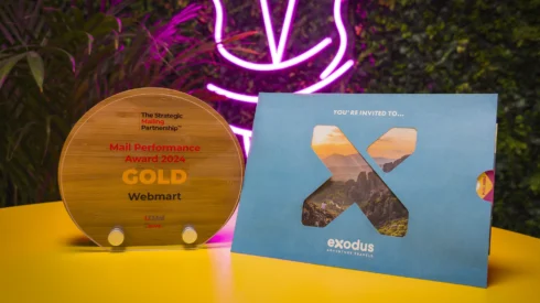 Exodus Adventure Travels SMP award winning campaign with Webmart, a pull out direct mailer sits next to a Gold marketing award for mail performance