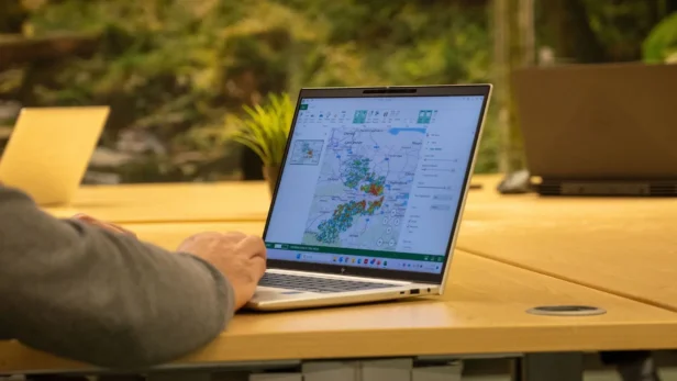 Audience data profiling on a laptop showing a heat map as part of a new print marketing campaign with Webmart, integrated marketing specialists.