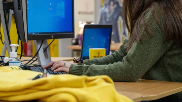 A Webmarteer works at a computer as part of a full-service marketing campaign.