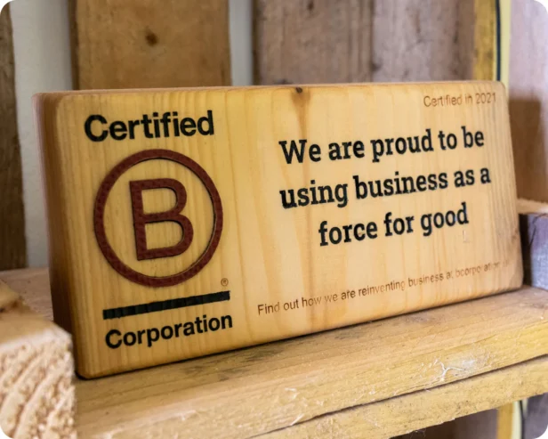 Webmart are a proud B Corp sign on a bench.