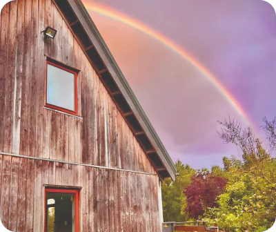 Image of a rainbow over Webmart's Oxygen Farm in Scotland.