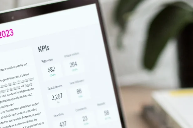Close up of a laptop screen showing marketing KPIs and performance metrics on a data studio dashboard as part of a digital marketing campaign.