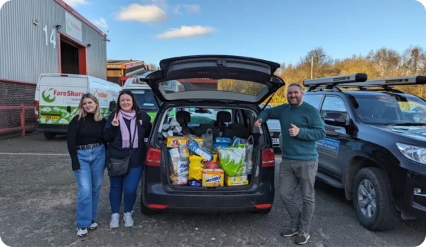 Webmarteers donating food to the Barnsley Food Bank with a car load of food