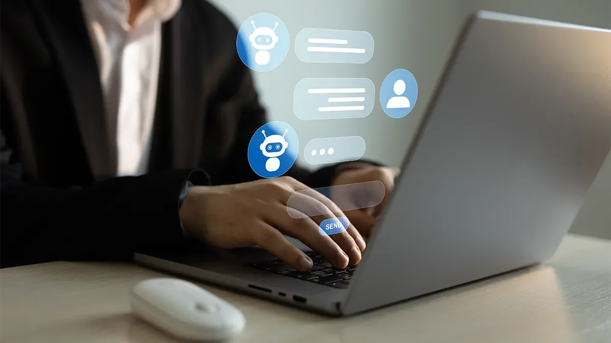 Person on a laptop chatting to an AI chatbot as one example of an AI agent that can learn from interactions. Expert marketing advice from Webmart.