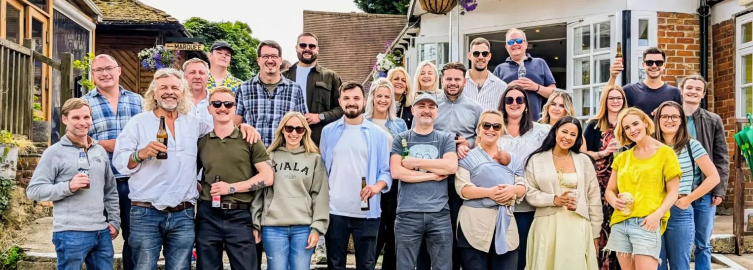 Webmart employees enjoying a drink at the 2024 summer party in Oxfordshire