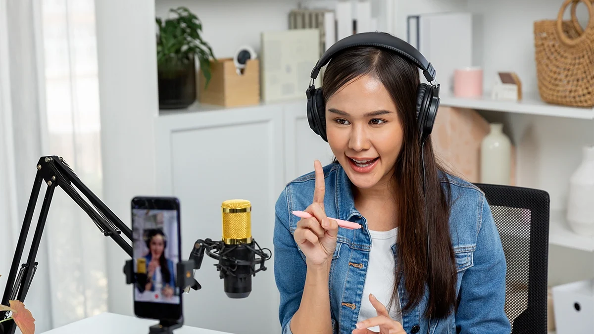 An online influencer records content on their phone for a brand product.