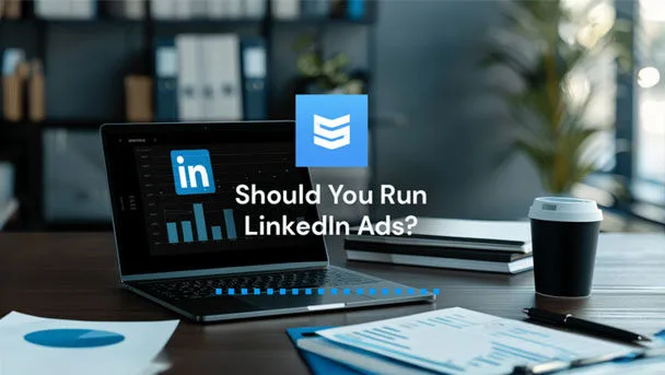 LinkedIn Ads and why you should run them. A laptop is open on a desk with the LinkedIn logo on the screen.