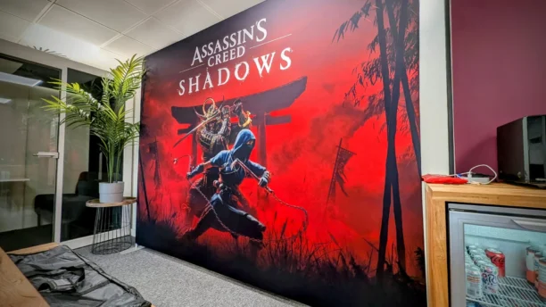 Creative and printed POS solution at Ubisoft's office for the launch of Assassin's Creed Shadows. Designed by the PoS Marketing Agency, Webmart.
