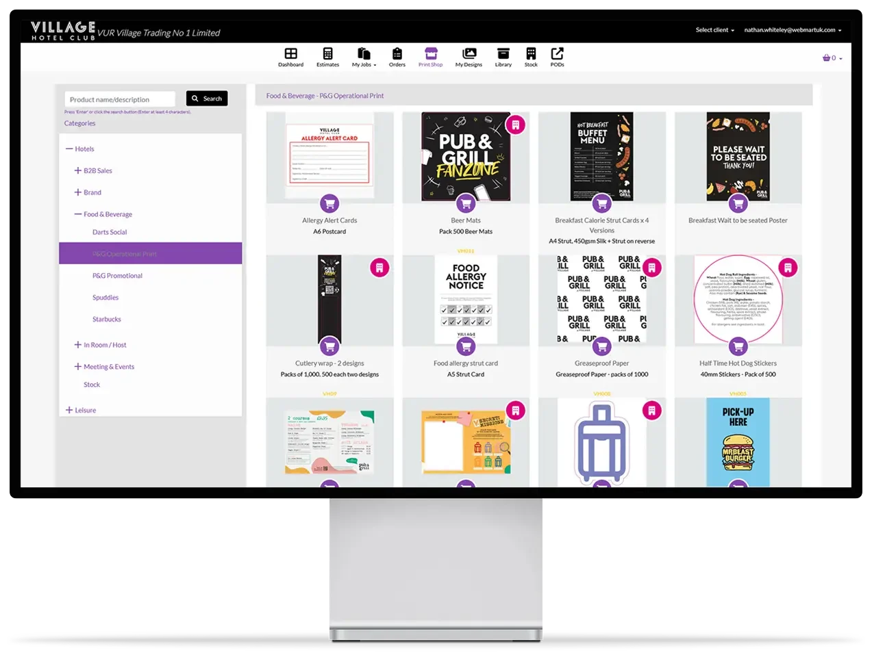 Computer screen shows the Village Hotels portal with editable templates and easy ordering through Webmart's print portal.