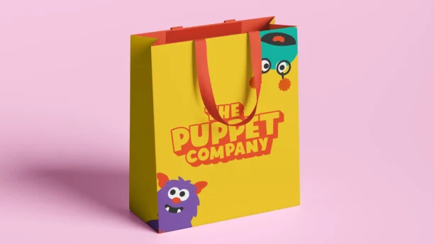 A picture of the new Puppet Company brand identity on a product bag. Designed by the brand marketing team at Webmart